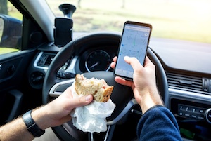 Man Eating While Driving