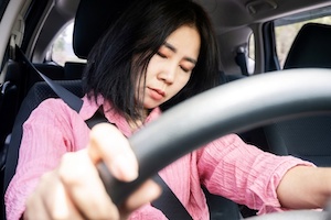 Sleepy Woman Driving